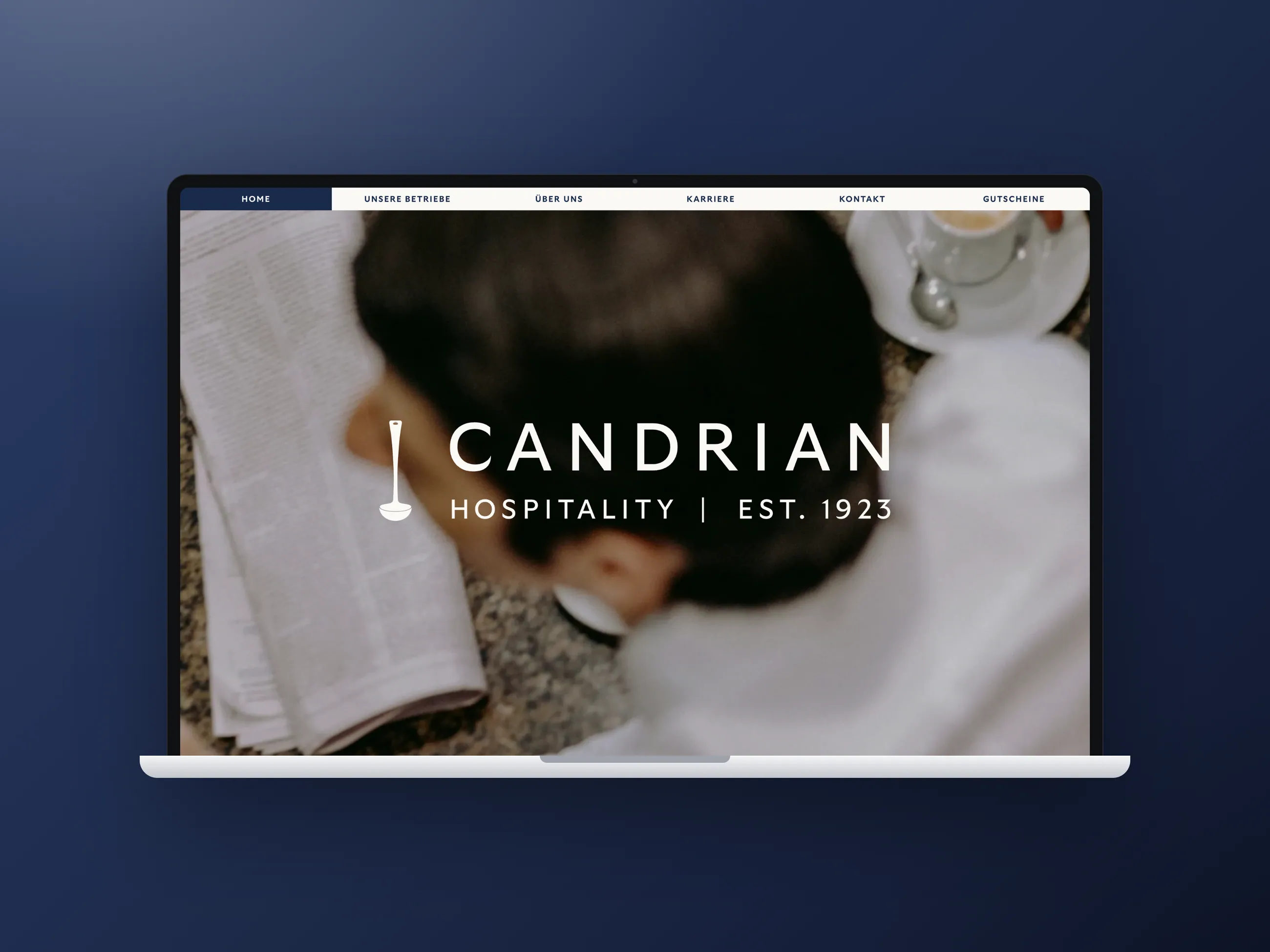 Candrian hospitality group website, desktop view in a laptop mockup